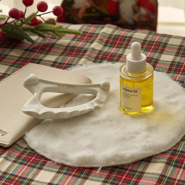 Ceramic Angel Gua Sha + Jojoba Oil Lymph Care Set by Face Factory - Available at allkpopmag. Price: $39.86.