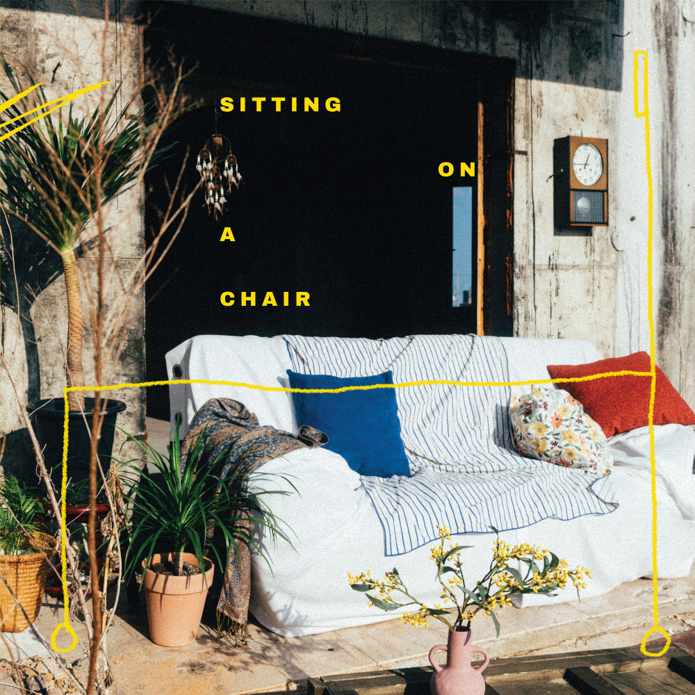 '-2nd-album-sitting-on-a-chair