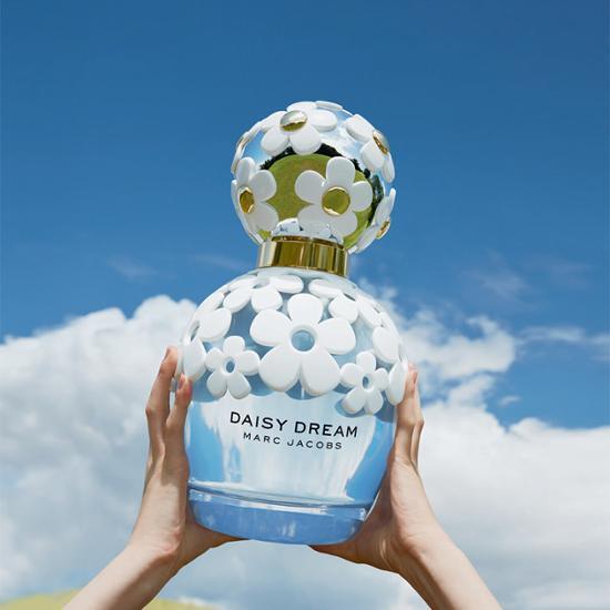Marc Jacobs Daisy Dream EDT 50ml fragrance bottle featuring a floral design, perfect for a refreshing and uplifting scent experience.