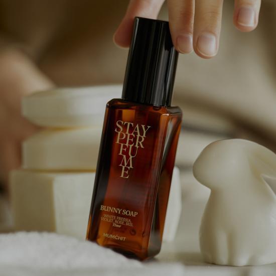 Momentary Stay Perfume 80ml featuring five unique scents: Rose Noir, Naughty Musk, Bunny Soap, Bombshell, and Narcissism, displayed elegantly in a stylish bottle.
