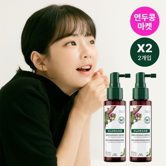 Two bottles of Klorane Quinine Edelweiss Scalp Serum 100ml, a nourishing hair care product designed for scalp health, featuring a K-Beauty formulation.