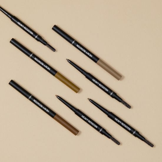 Image of Kiss Me Heavy Rotation Gel Eyebrow Liner in Natural Brown, showcasing the product's sleek design and three color options.