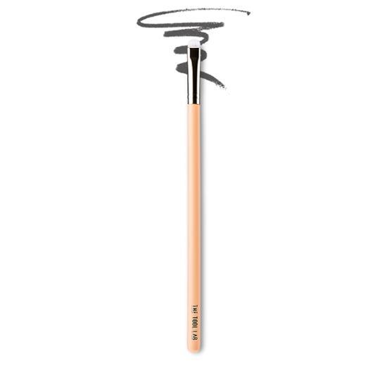 Close-up of The Tool Lab 221 Eyeliner Definer Brush, a precision beauty tool designed for flawless eyeliner application, featuring a sleek design ideal for K-Beauty enthusiasts.