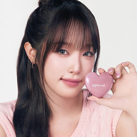 Peach Beam color of Lilybyred Love Beam Cheek Balm in a sleek container, showcasing its creamy texture ideal for a natural blush.