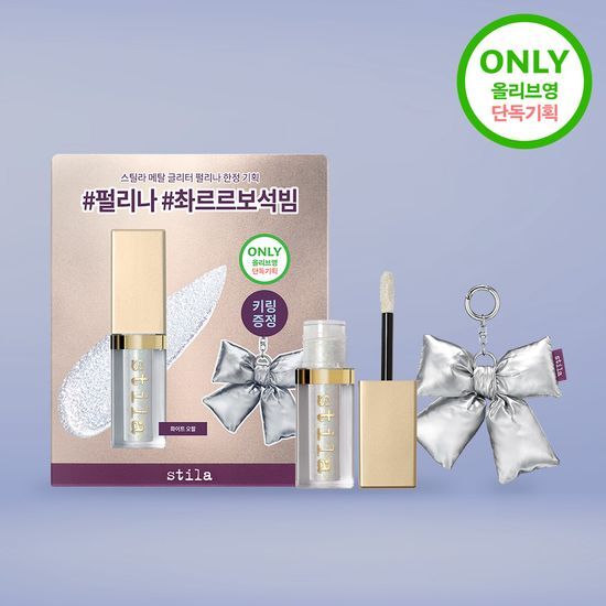 Stila Magnificent Metal Glitter & Glow Liquid Eyeshadow in a sleek tube, showcasing a shimmering gold shade perfect for adding sparkle to your makeup look.