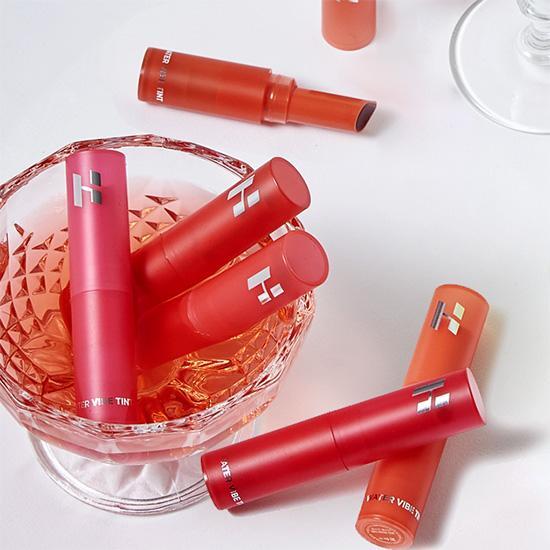 Holika Holika Water Vibe Tint in shade 04 Poodle, showcasing a vibrant and moisturizing lip tint with a playful design.