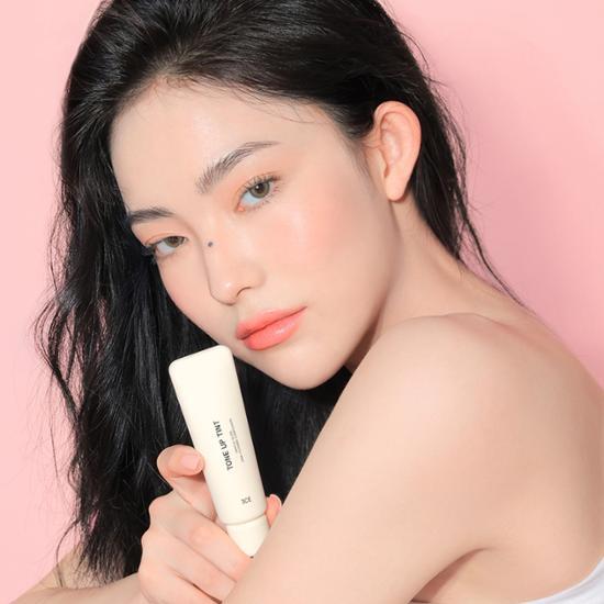 3CE Tone Up Tint - A lightweight, brightening lip tint in a sleek packaging, perfect for a natural flush of color.