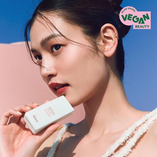 Light Peach HINDS Second Skin Tone-Up Base by hince, enhancing natural complexion with a smooth finish.