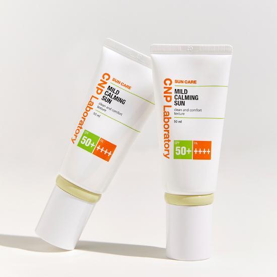 Set of CNP Mild Calming Sun 50ml sunscreen bottles, perfect for skincare enthusiasts, featuring Chae & Park's K-Beauty formula for sun care.