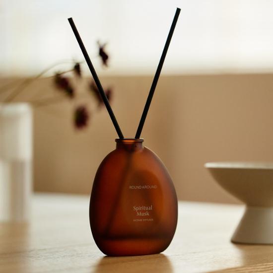 Round Around Incense Diffuser in Wood Champha fragrance, perfect for enhancing ambiance and well-being.