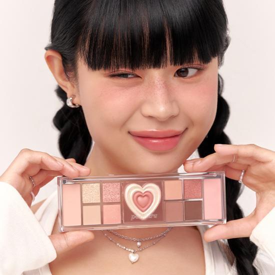 Peripera All Take Mood Like Palette in Prestige Pink, featuring a range of vibrant eyeshadow shades perfect for creating versatile makeup looks.