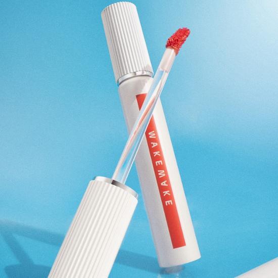 Wake Make Water Blurring Fixing Tint in Ocean Pink, a lightweight lip tint with a smooth finish, available in a 13-color range.