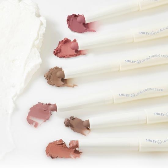 Close-up of Lilybyred Smiley Lip Blending Stick in shade 03 Delightful, showcasing its vibrant color and sleek design.