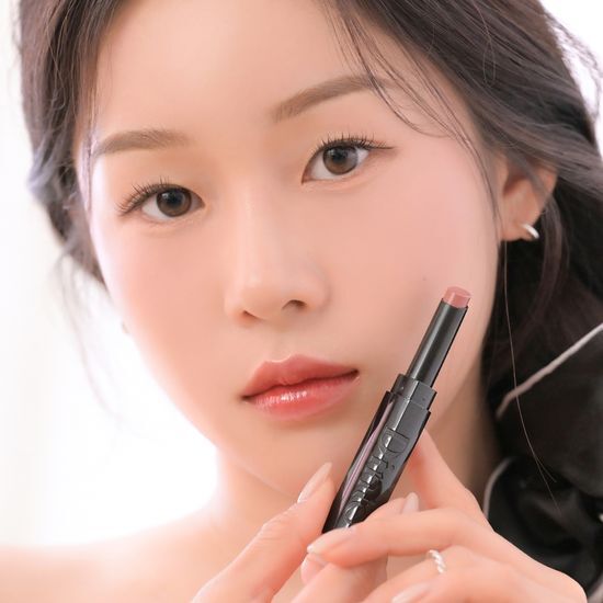 Image of Dinto Bronte Melting Glow Lip Balm in shade 302 Emily, showcasing a vibrant pink color from a collection of 10 shades.