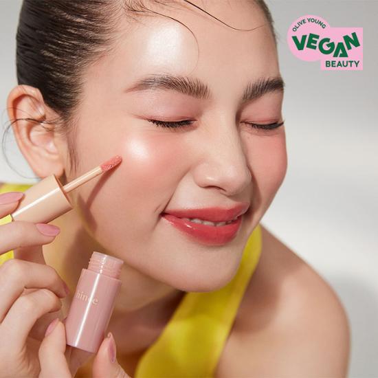 Liquid blush in Warm Freckle shade by Hince, showcasing a dewy finish for a natural glow.