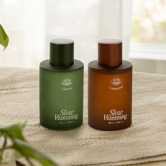 Slow Humming Cabin Cedar Fragrance Spray 100ml - A woody and calming scent perfect for personal care.