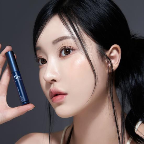 Black/Brown Mornings Black Bean Biotin Coating Mascara displayed in a sleek tube, perfect for enhancing eyelashes with nourishing ingredients.