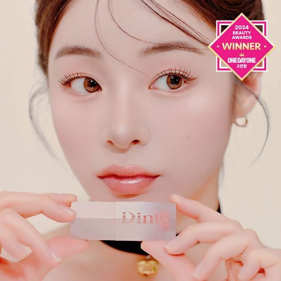 Close-up of Dinto Blur Jelly Plumping Lip Tint in shade 771 Pink Julep, showcasing its vibrant pink color and sleek packaging.