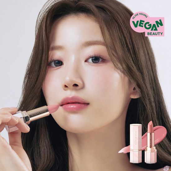 Dear Dahlia Lip Paradise Sensual Lip Glow in shade Felicia, showcasing a vibrant pink hue in an elegant tube.
