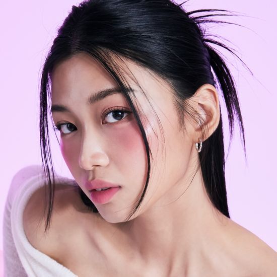 Tony Moly Cheek Tone Lip & Cheek Duo Balm in Sunday Coral shade, showcasing a vibrant coral color perfect for lips and cheeks.