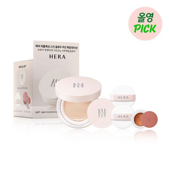 **Alt Text:** Hera Reflection Skin Glow Cushion 15g in limited edition 21N, featuring a mini cushion, eye glitter, and puff in shade 21C, beautifully packaged for a radiant complexion.