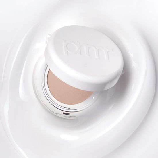 Primera Niacinamide Watery Cream Cushion 15g in Shade 1/2 Beige, featuring a sleek compact design for easy application.