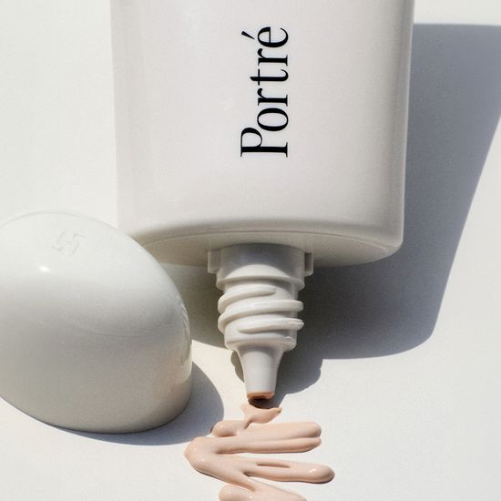 Portre Blur Skin Tint 50ml in Ivory variant, showcasing a sleek bottle design for a flawless complexion.