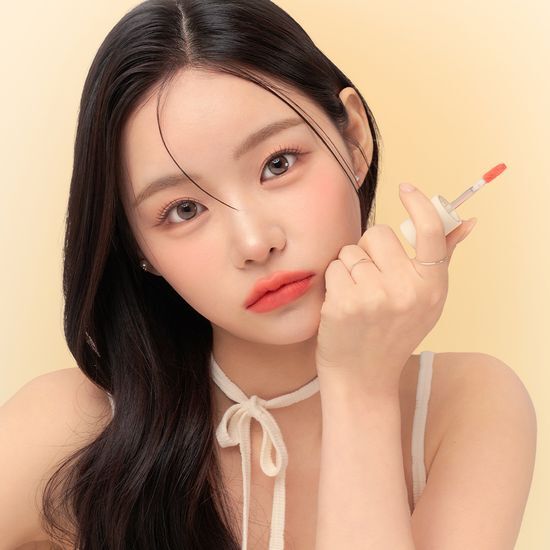 Alt text: Giverny Fluffy Sheer Tint in Peach Melo, 3.5g, featuring a soft peach color, part of a five-color collection, perfect for a natural look.